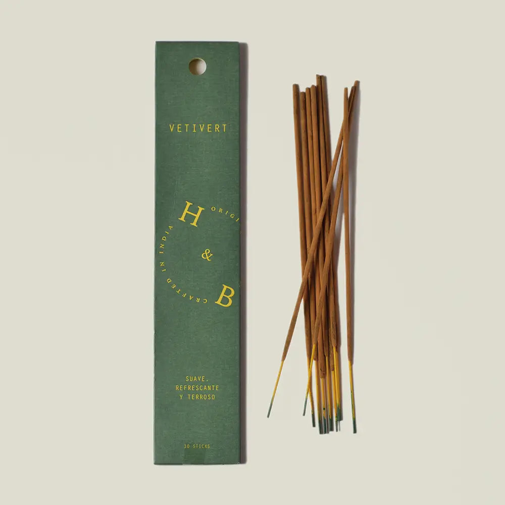 Earthy, refreshing vetiver and bergamot incense sticks, natural resin and spice blend, hand-rolled texture, calming aromatic plant essence, eco-conscious interior scent ritual product.