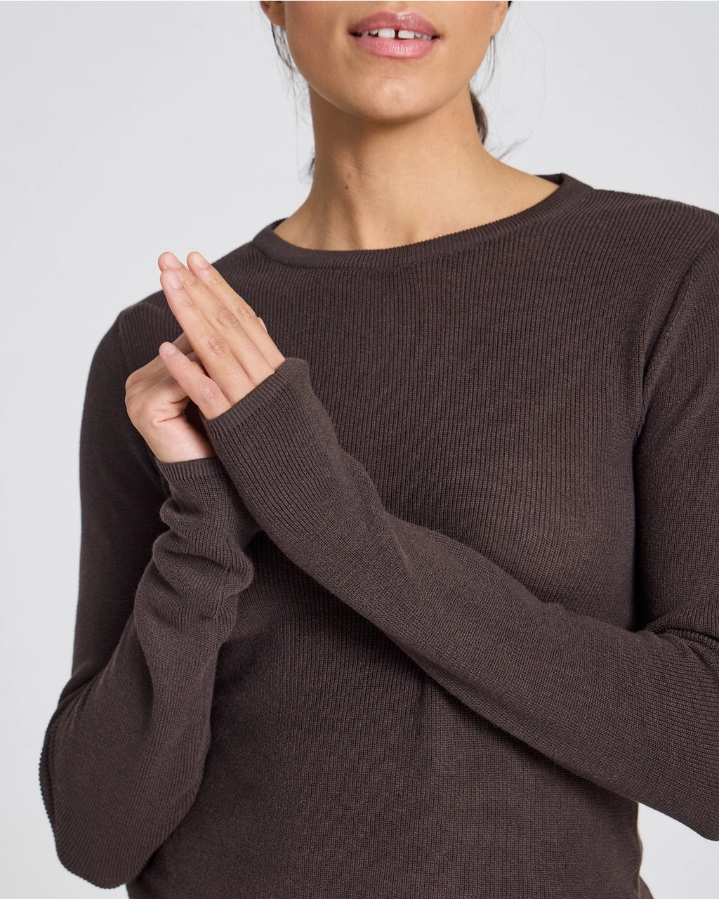 Brown long-sleeve t-shirt made from 100% GOTS-certified organic cotton, minimalist fit, smooth natural fabric texture, curated wardrobe staple.