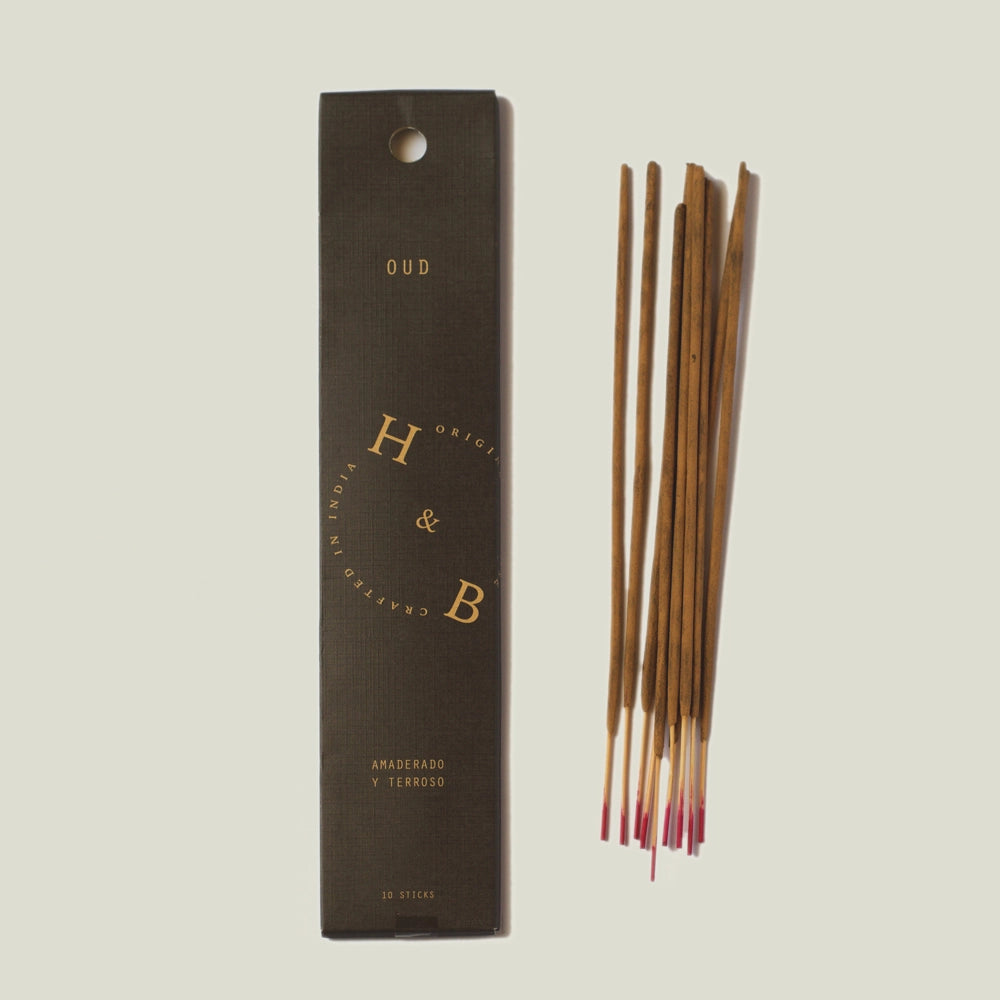 Natural resin and oud incense sticks by H&B, woody-earthy aromatic profile, hand-rolled stick texture, oud wood, frankincense, myrrh resin blend, subtle citrus undertone, interior scent ritual essential.