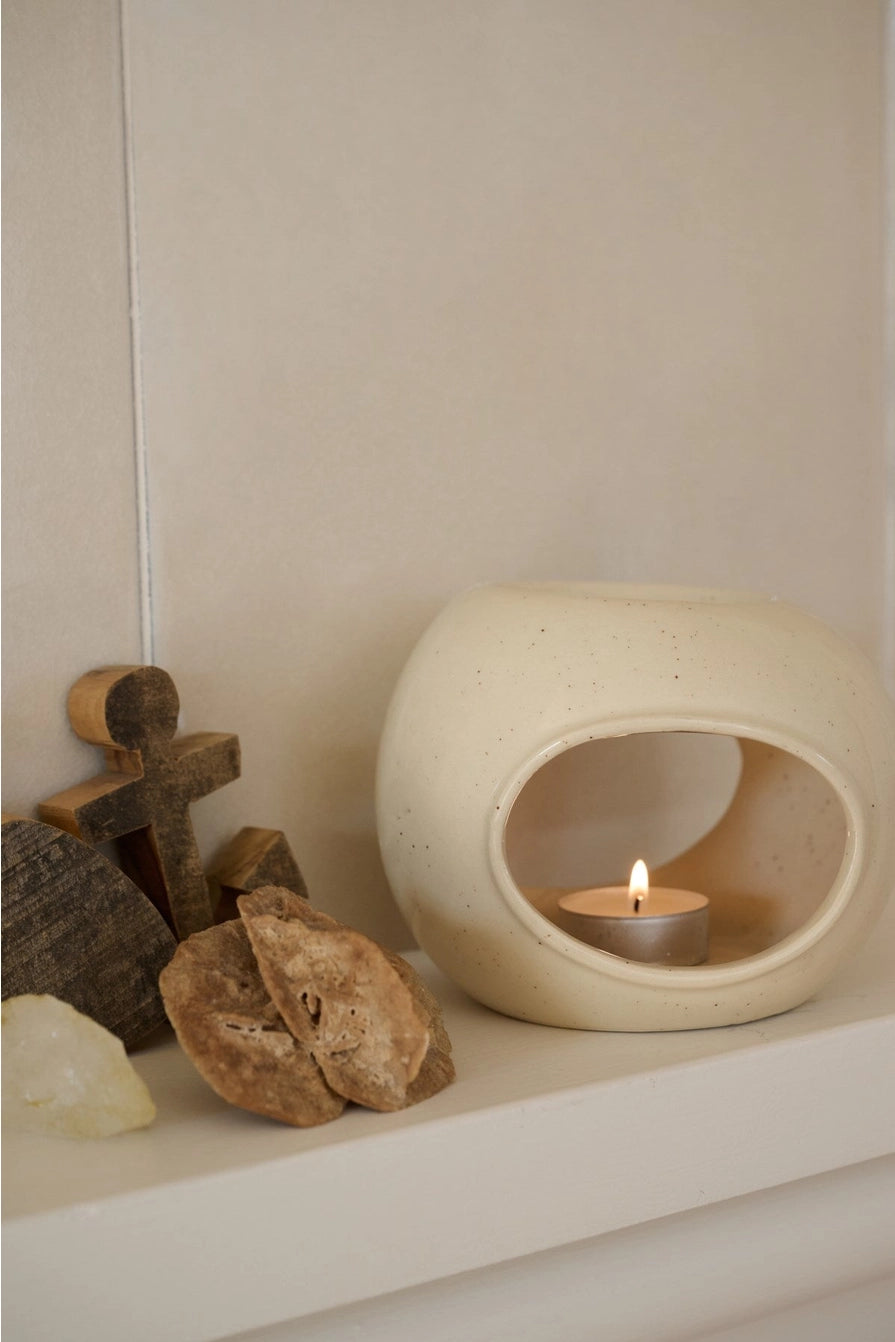 Ceramic aroma lamp by Moshi Moshi, handmade minimalist form, smooth matte surface, neutral-toned interior ritual essential.